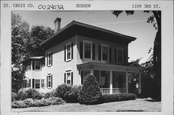 A black and white photograph of the house that held the original library.